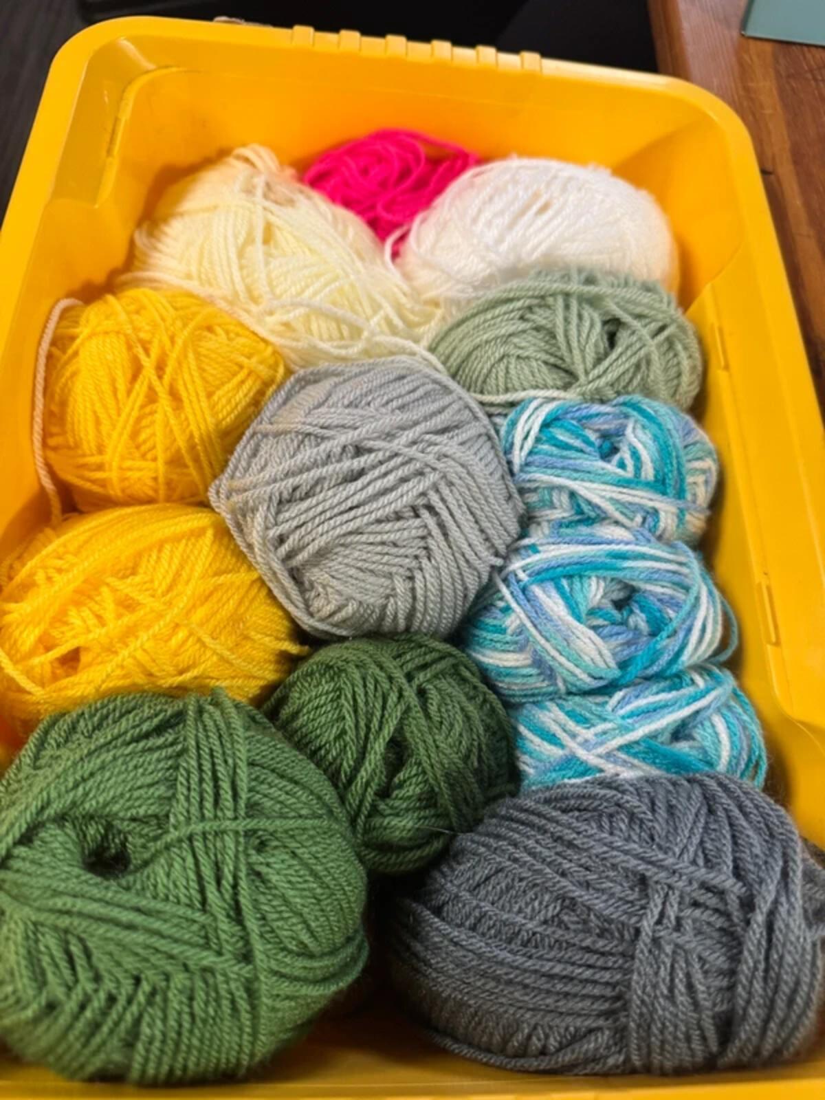Bundle of Wool Balls and Knitting Needles