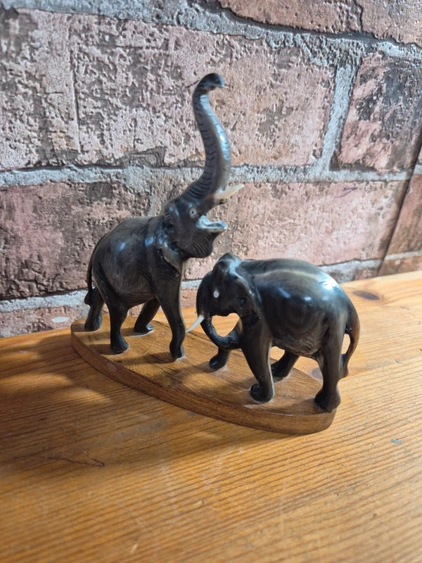 Carved water buffalo elephant on wood base
