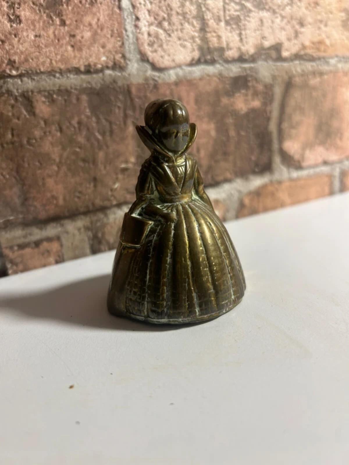 Vintage brass bell lady