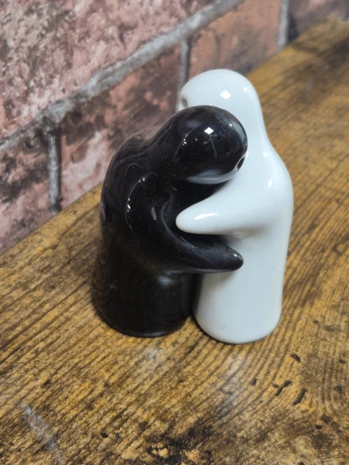 Hugging salt and pepper shakers