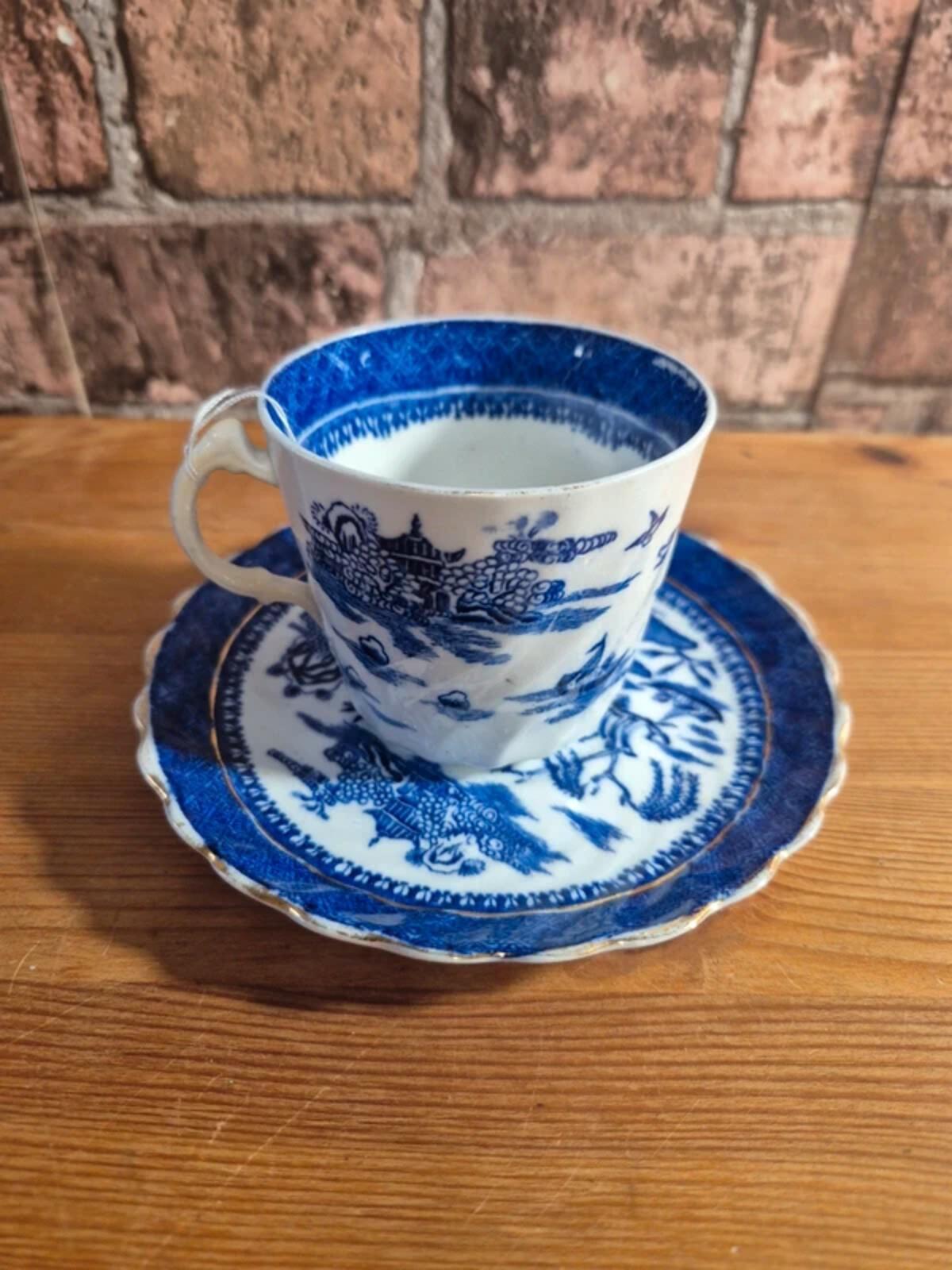 Antique blue and white willow cup & saucers
