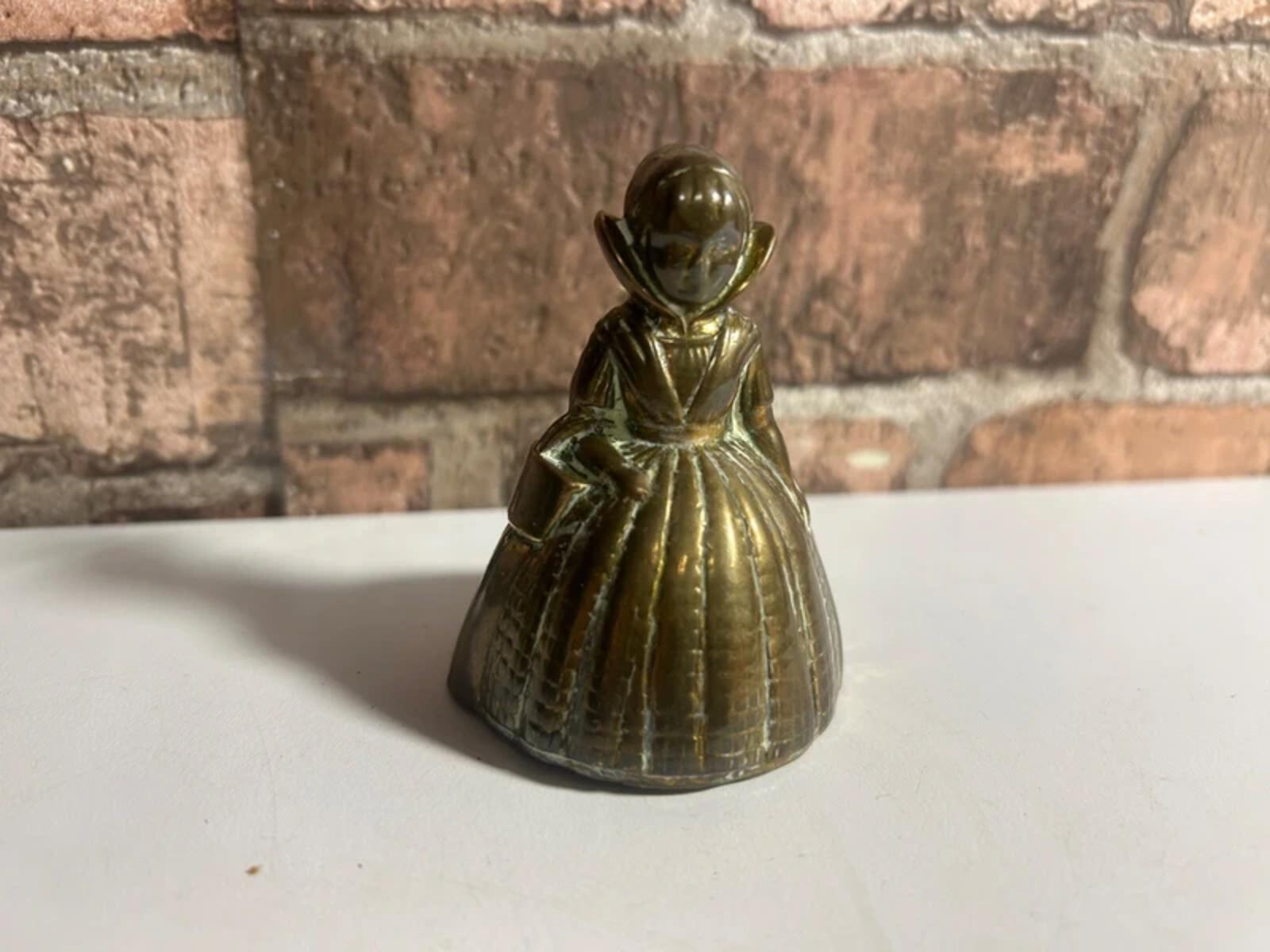 Vintage brass bell lady