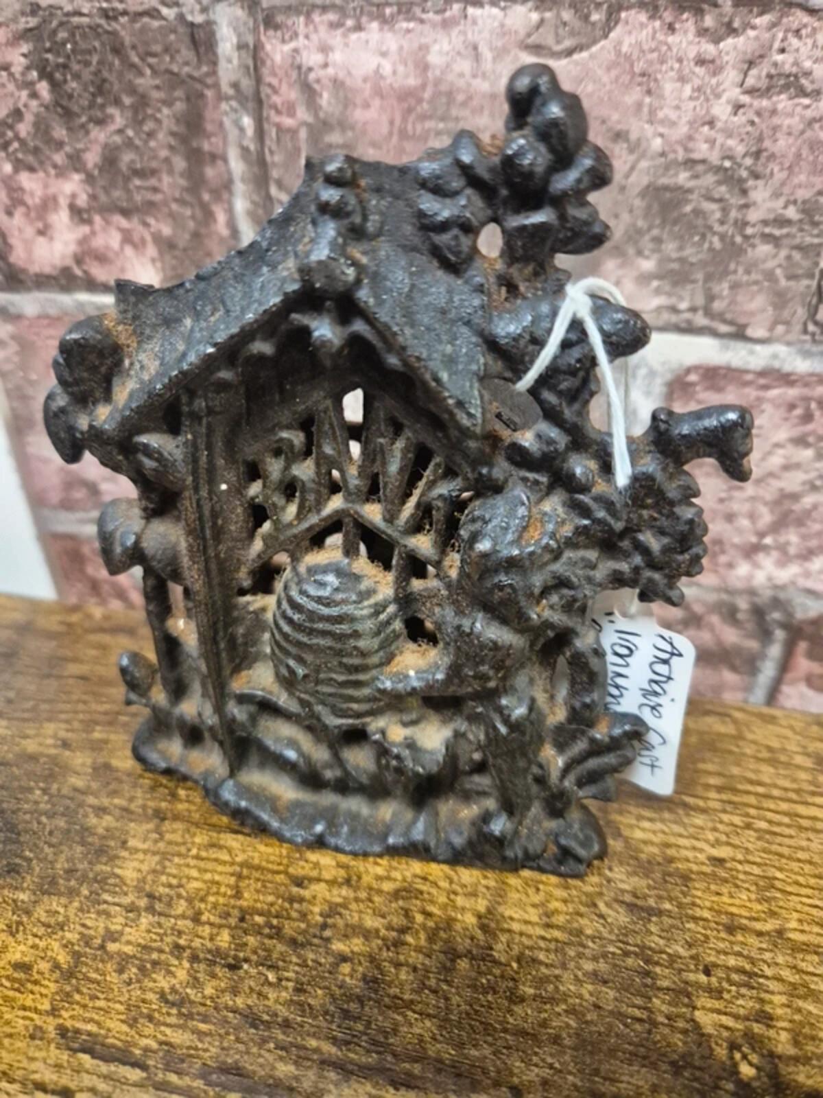 Antique Cast iron 'bear & hive' money box