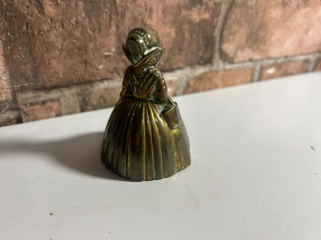 Vintage brass bell lady