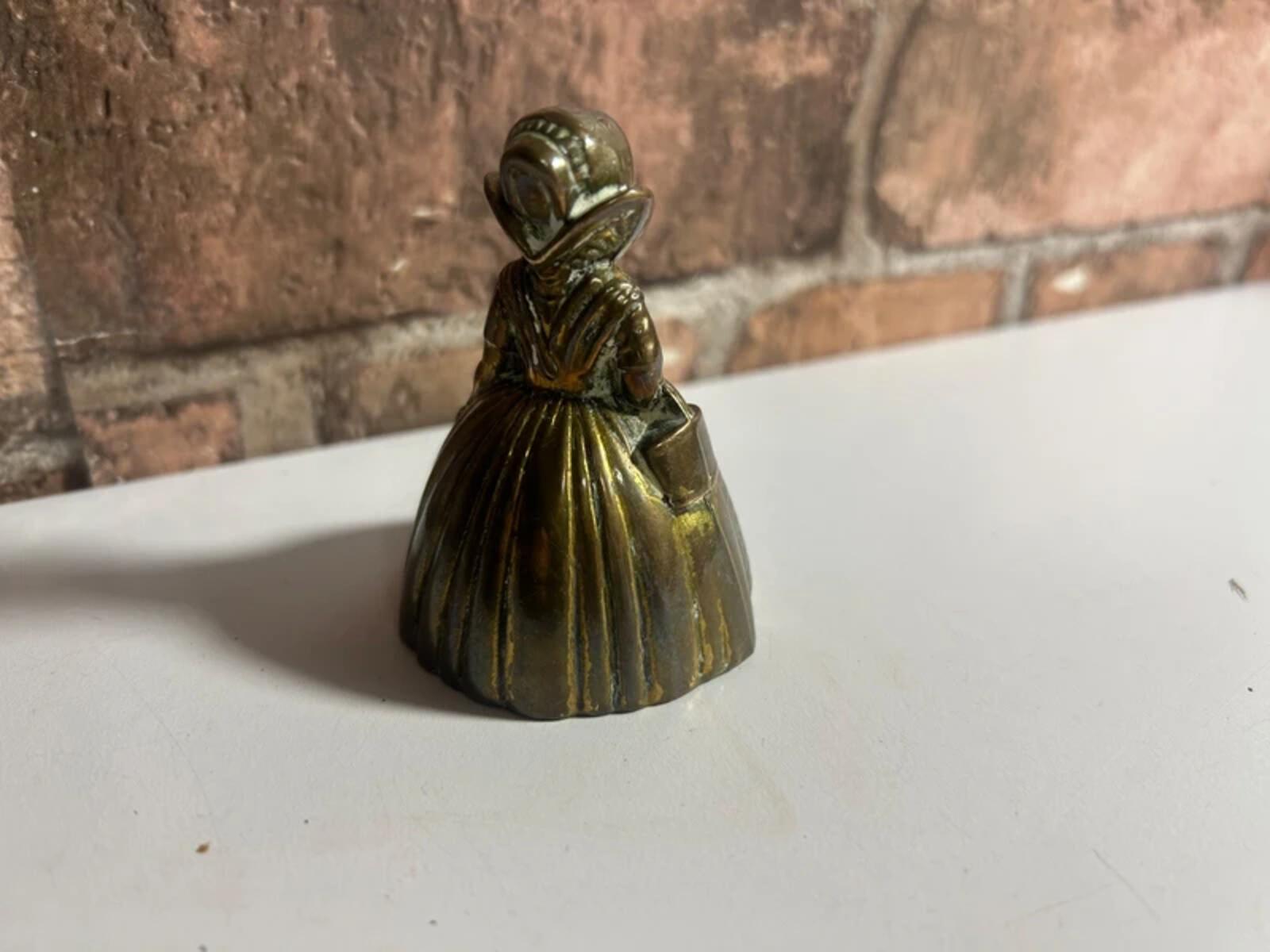 Vintage brass bell lady