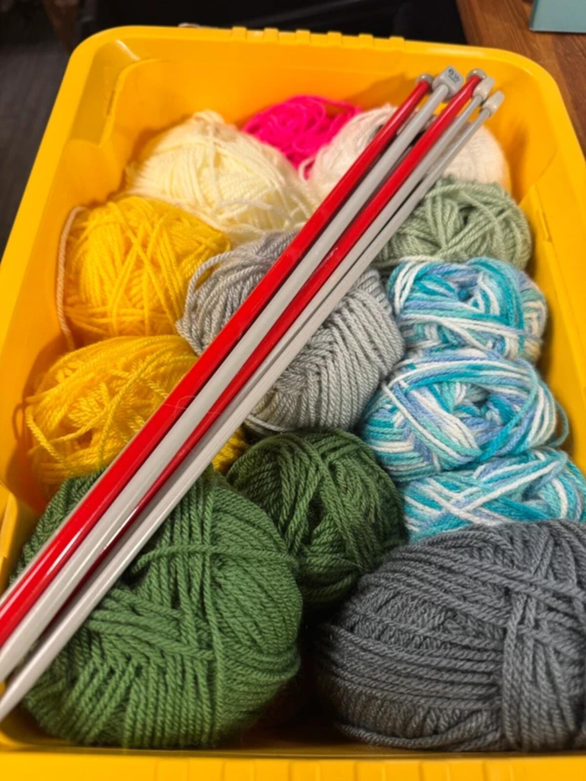 Bundle of Wool Balls and Knitting Needles