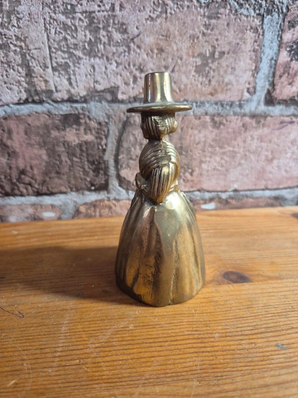 Brass bell lady