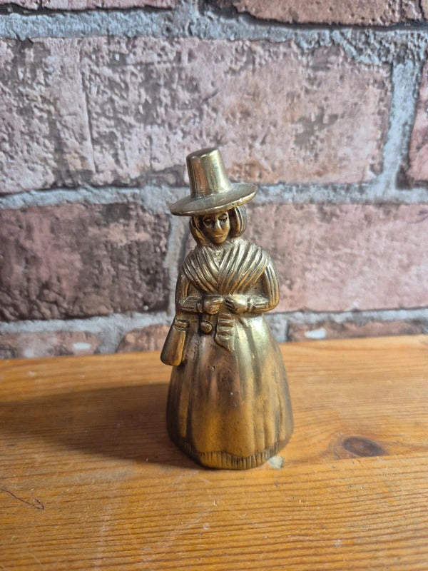 Brass bell lady