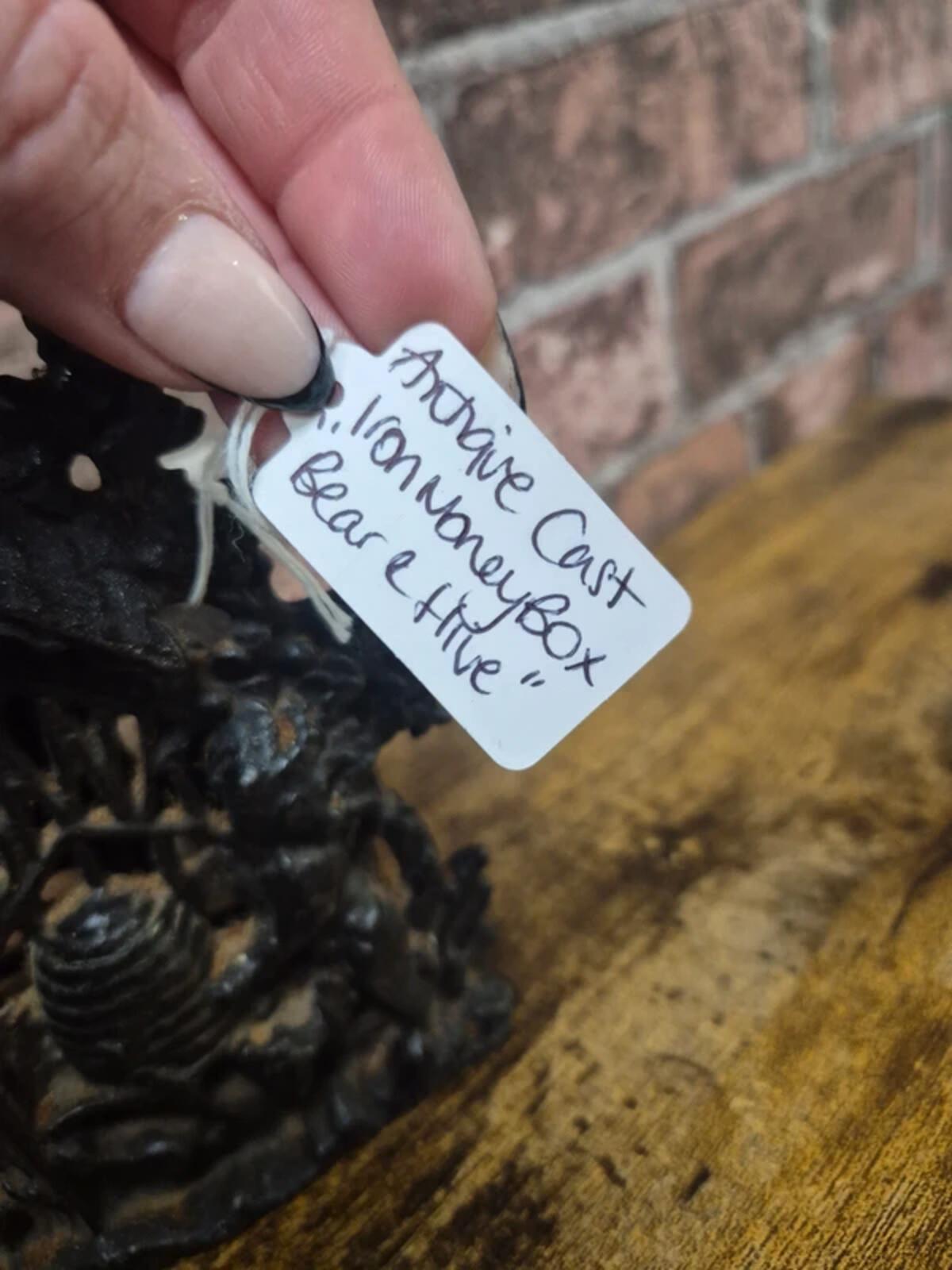 Antique Cast iron 'bear & hive' money box