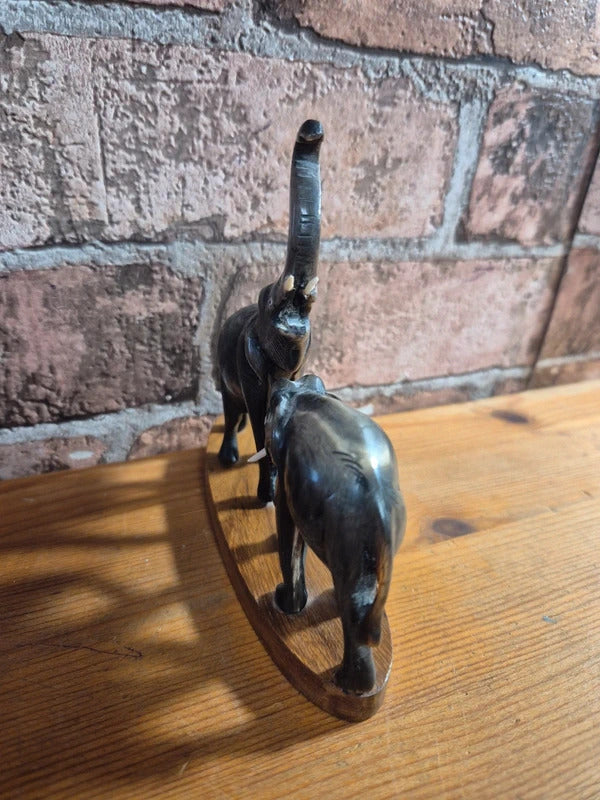 Carved water buffalo elephant on wood base