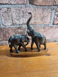 Carved water buffalo elephant on wood base